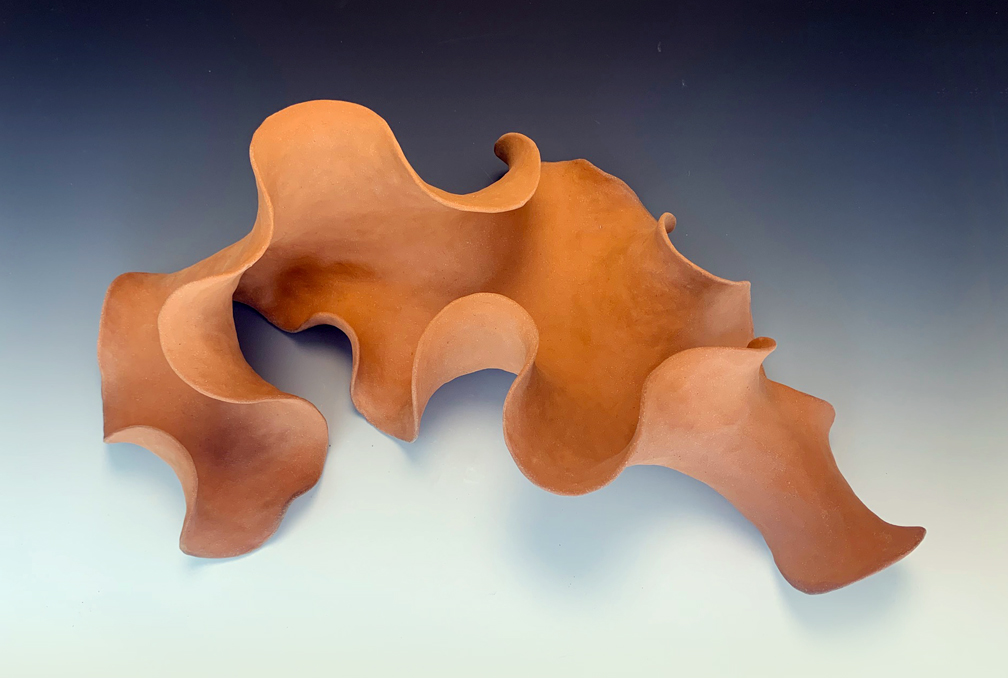 Ceramic sculpture of a growth form.